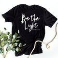 Be the Light Christian Black Bella Women's Graphic Tee