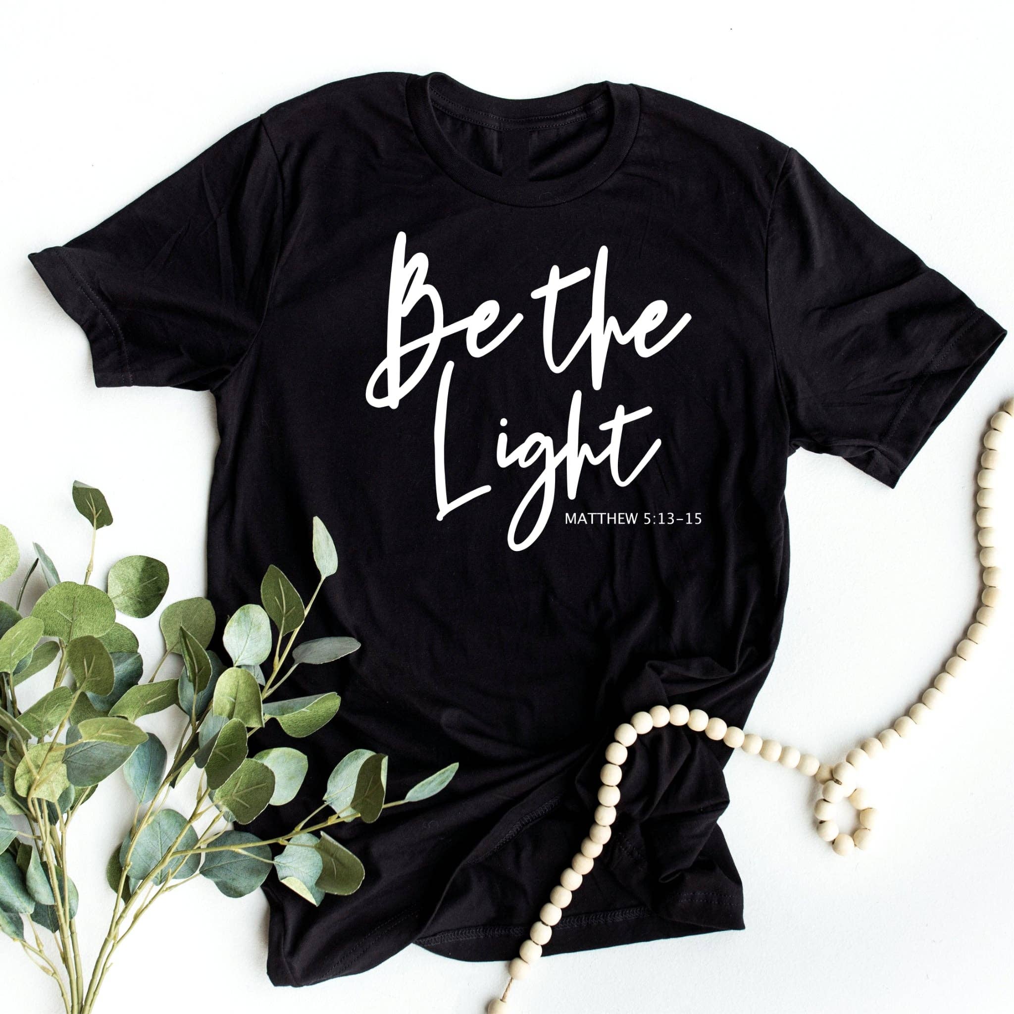 Be the Light Christian Black Bella Women's Graphic Tee